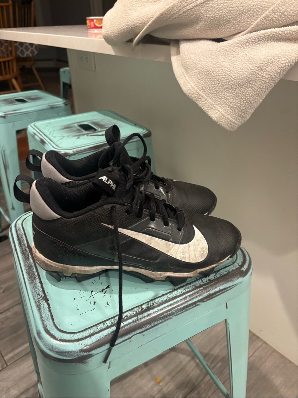Nike Black and White Men's Athletic Cleats with Silver Swoosh